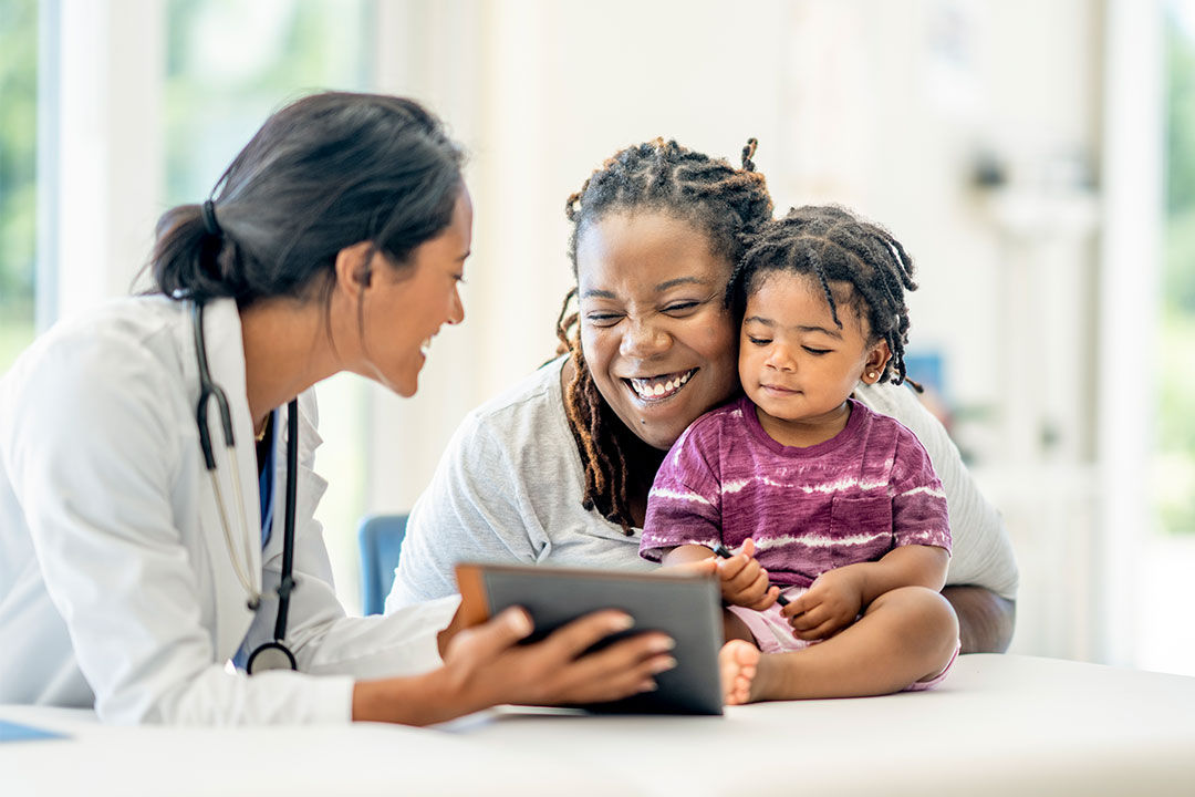Physician with mother and child.